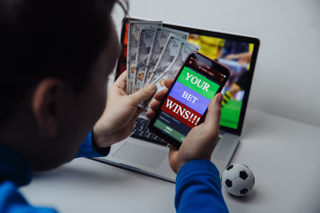 1744370100-lucky-male-winner-football-betting-with-dollar-money-phone-hands-bet-wins_253401-2656.jpg