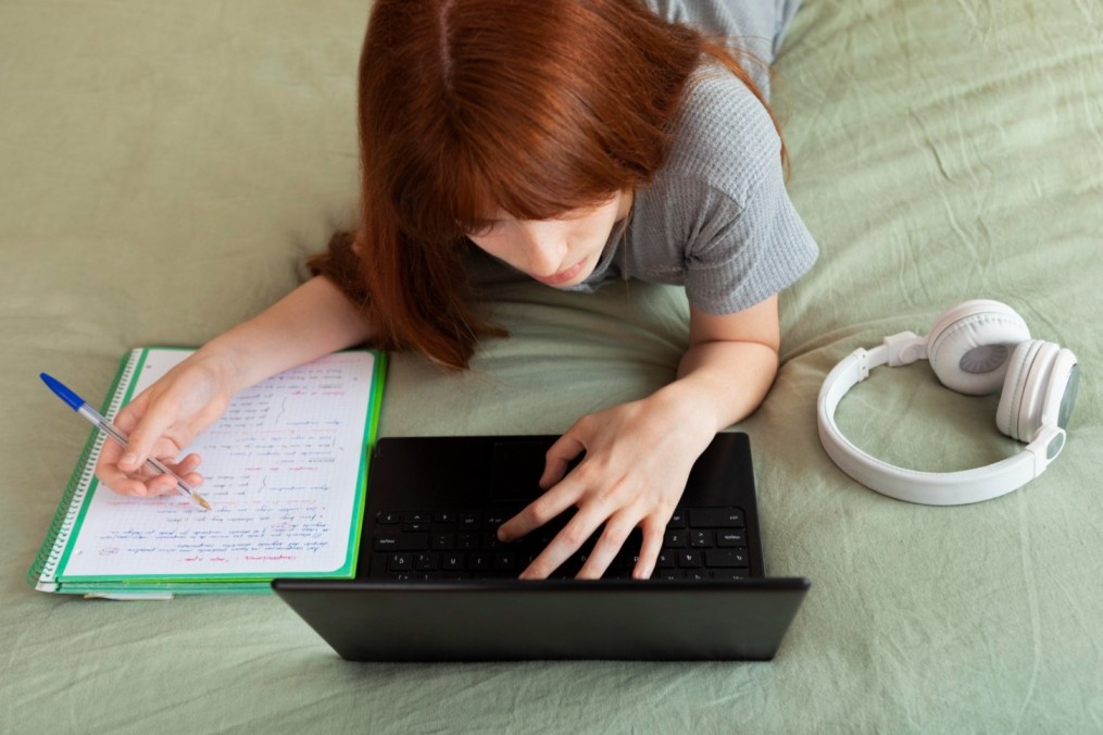 1753795363-close-up-girl-studying-with-laptop_(1)_(1)_(1)_(1)_(1).jpg